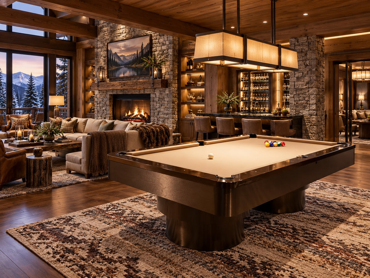 Bronze pool table with cream cloth in a mountain lodge great room with a stone fireplace